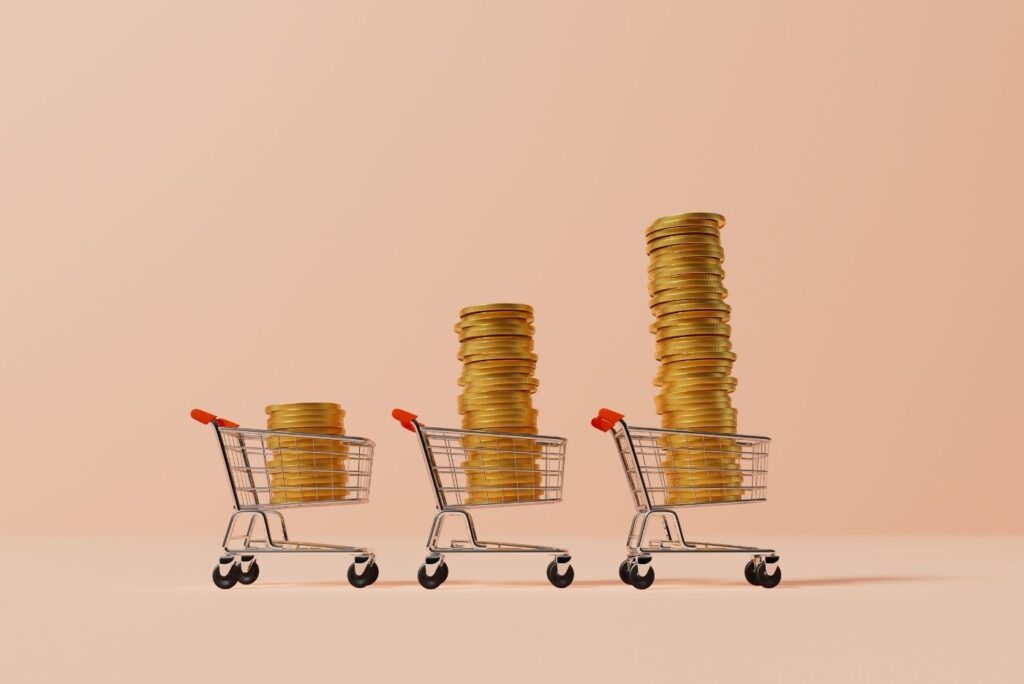 shopping trolley with stack of gold coins inflation concept
